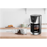 Black,Coffee,Machine,With,Cup,And,Jar,Of,Beans,On