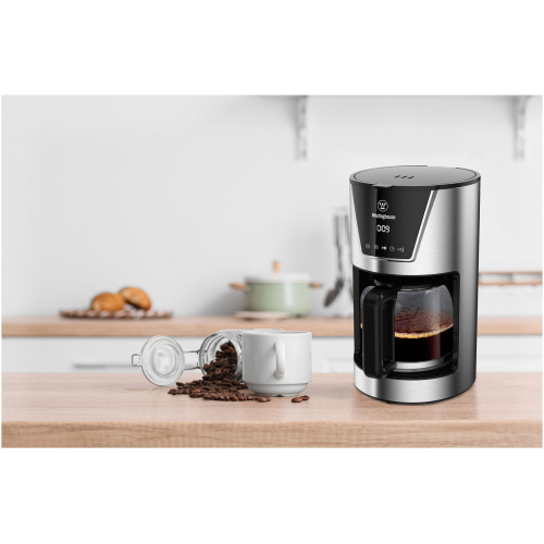 Black,Coffee,Machine,With,Cup,And,Jar,Of,Beans,On